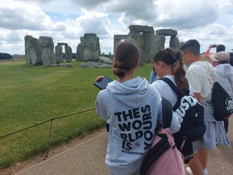 Imagine1world students visiting Stonehenge during a day trip