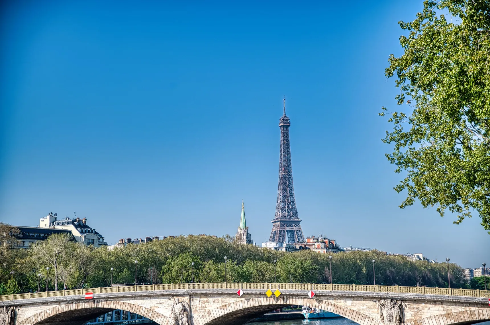 The Eiffel Tower seen from a bridge over the Seine