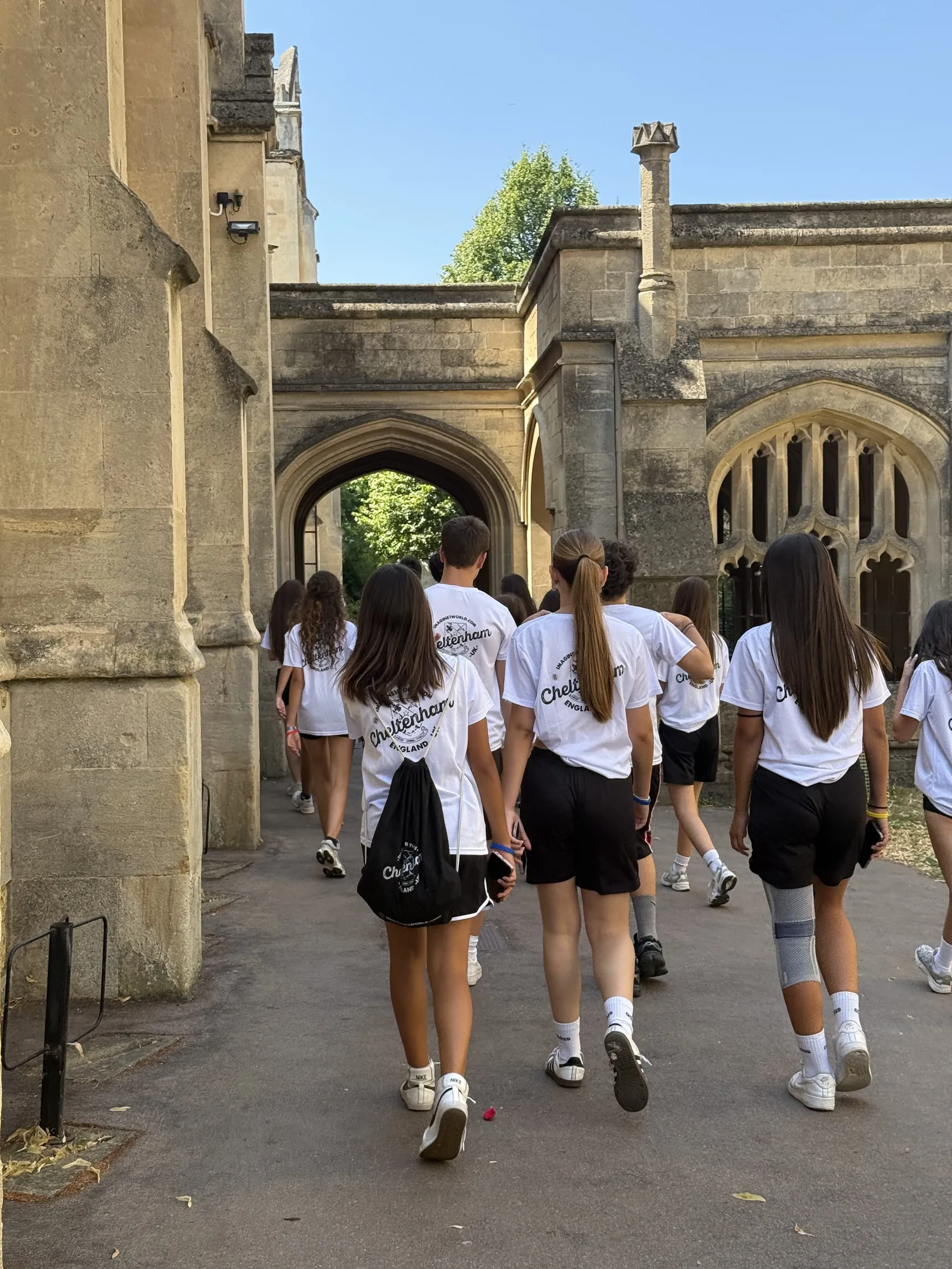 Students among historic buildings during a visit